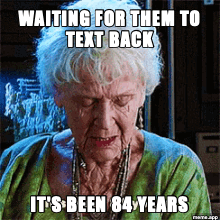 Animated GIF of elderly Rose from Titanic looking down with caption about waiting for a text reply
