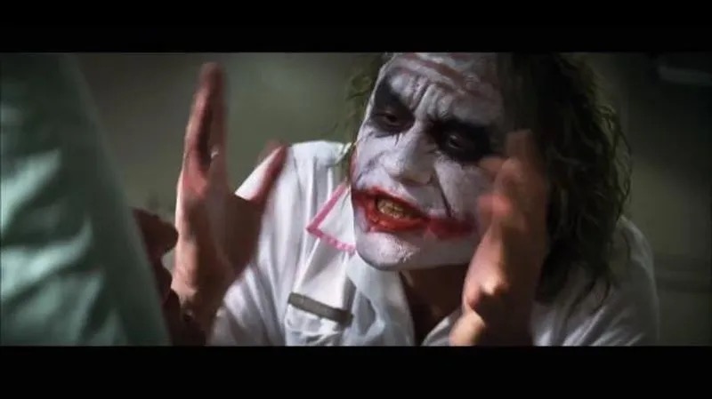 And Everybody Loses Their Minds meme template - Heath Ledger as the Joker, purple suit, green hair, smeared white face paint. He gestures with both hands while making a phil