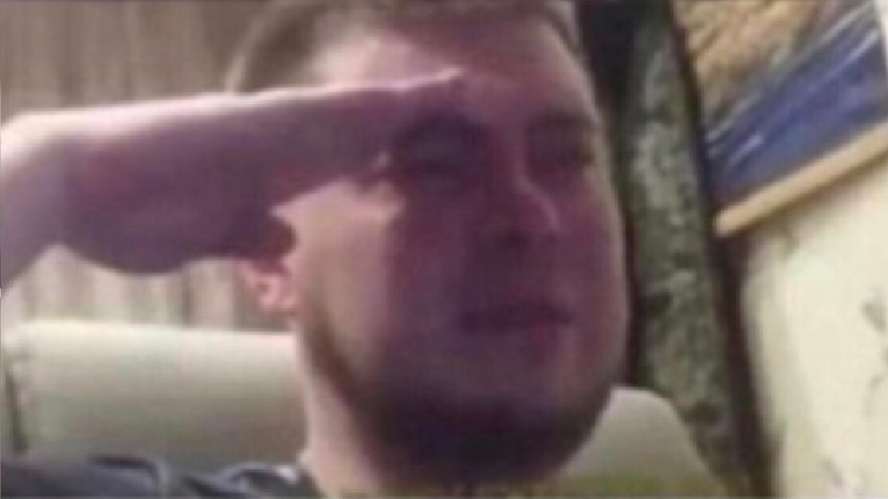 Crying Salute meme template - A man in a dimly lit room, tears visible on his face, raising his right hand in a firm military-style salute. The webcam angl