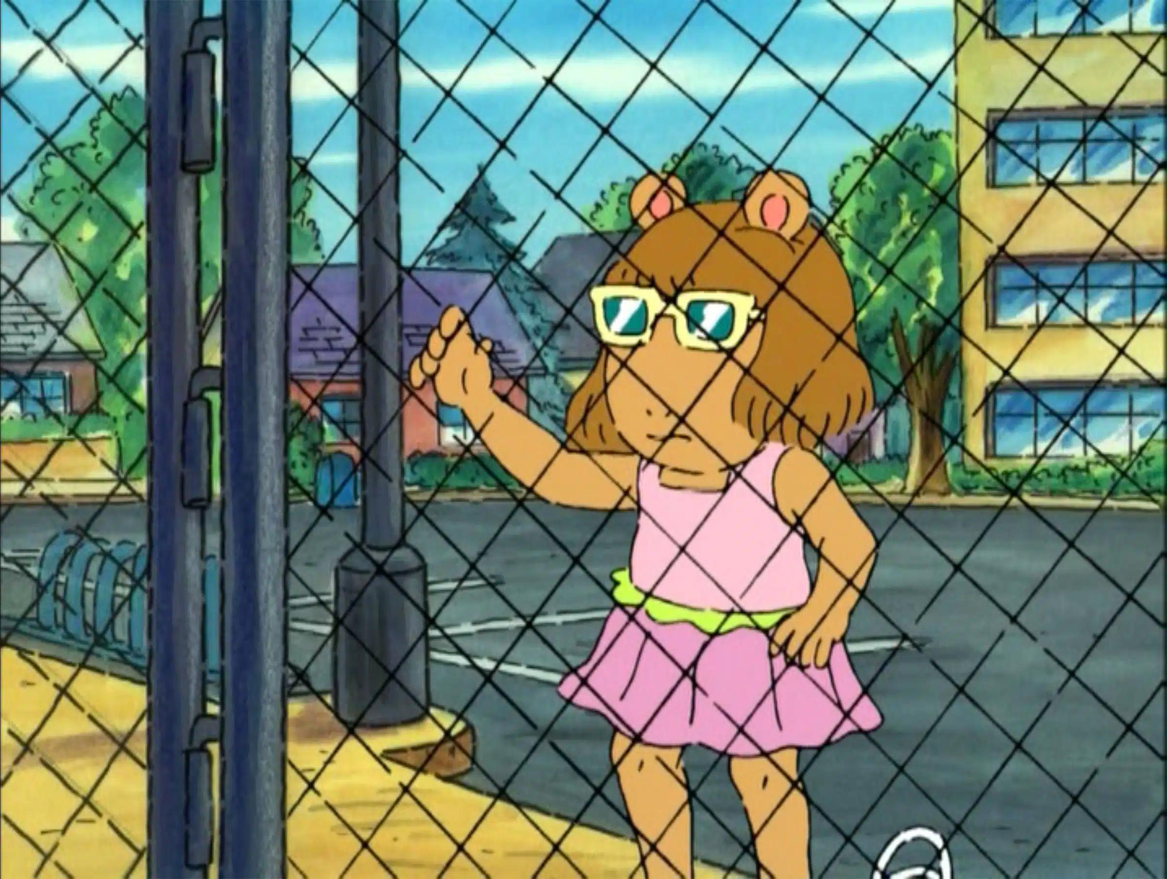 DW Looking Through Fence meme template - DW from the PBS cartoon Arthur, seen from a wider angle, standing at a chain-link fence and looking through it. She is wearin