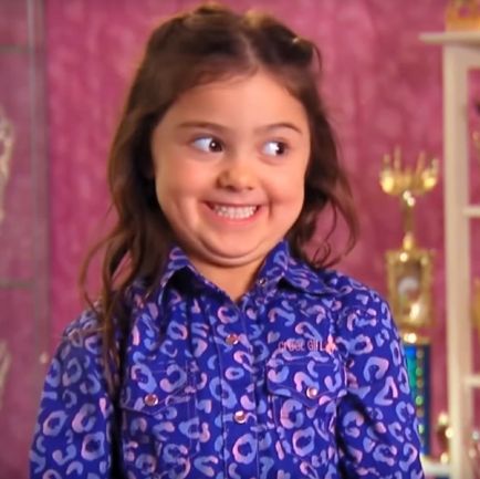 Grinning Girl meme template - A young girl photographed with an enormous, full-face grin. The smile is wide enough to crinkle her entire face and communica