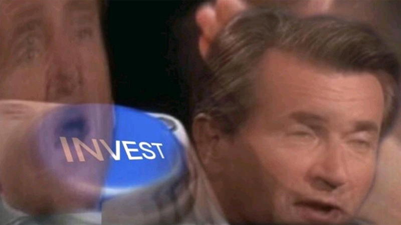 Invest Button meme template - Robert Herjavec from Shark Tank positioned with his hand pressed firmly down on a large glowing blue button labeled "INVEST."
