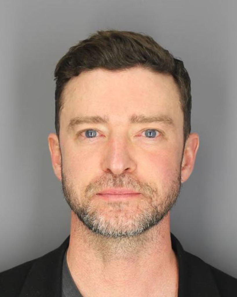 Justin Timberlake DUI Mugshot meme template - Justin Timberlake's official police mugshot stares back at you from the template. The grey background. The bloodshot eyes. Th