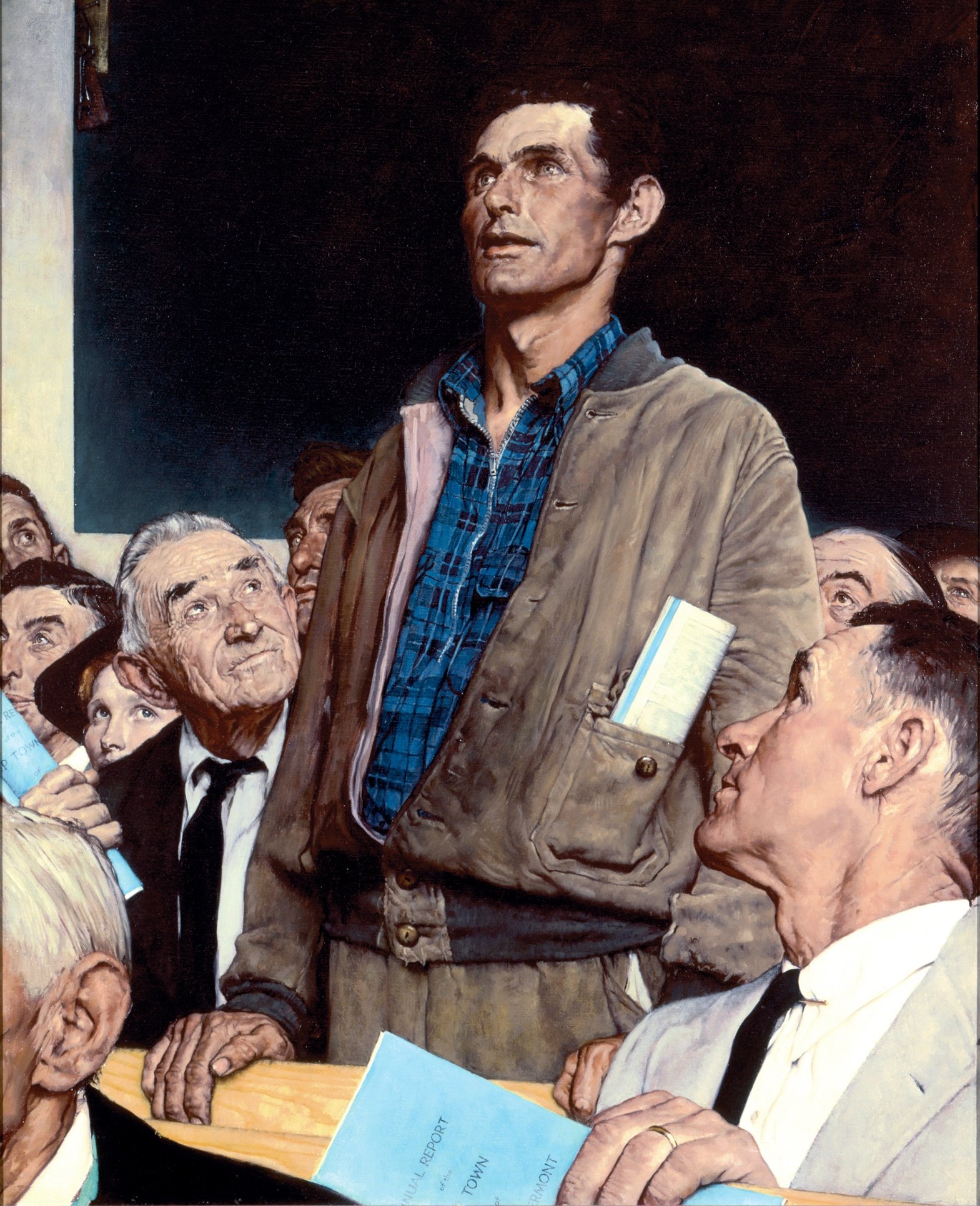 Man Taking A Stand In Town Hall Meeting meme template - A man stands in a town hall meeting, surrounded by seated attendees. He is on his feet because what he has to say cannot be s