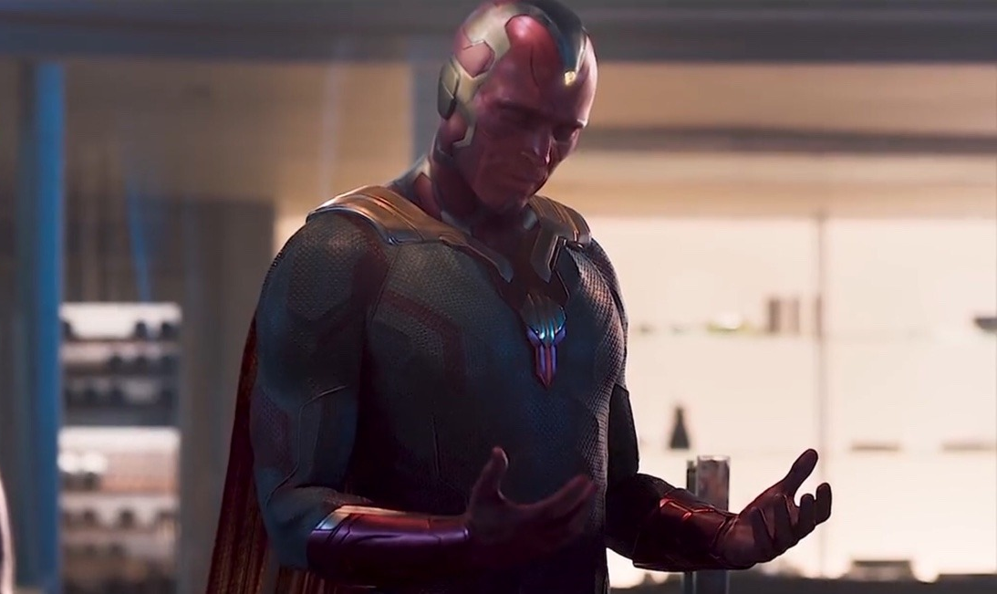 Maybe I Am A Monster meme template - Vision from WandaVision stares down at his own hands in contemplation, the weight of self-doubt visible on his synthetic face