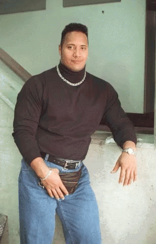 The Rock Turtleneck GIF meme template - An animated GIF of young Dwayne "The Rock" Johnson in the iconic black turtleneck, silver chain, and fanny pack. The movement