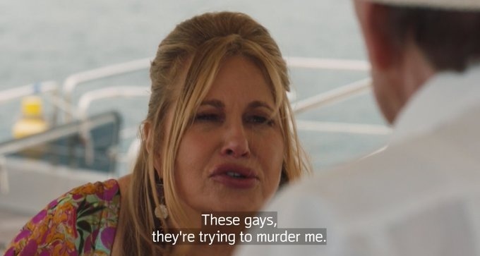 These Gays Trying To Murder Me meme template - A screenshot from HBO's The White Lotus Season 2 showing Jennifer Coolidge as Tanya McQuoid wearing a floral top outdoors nea
